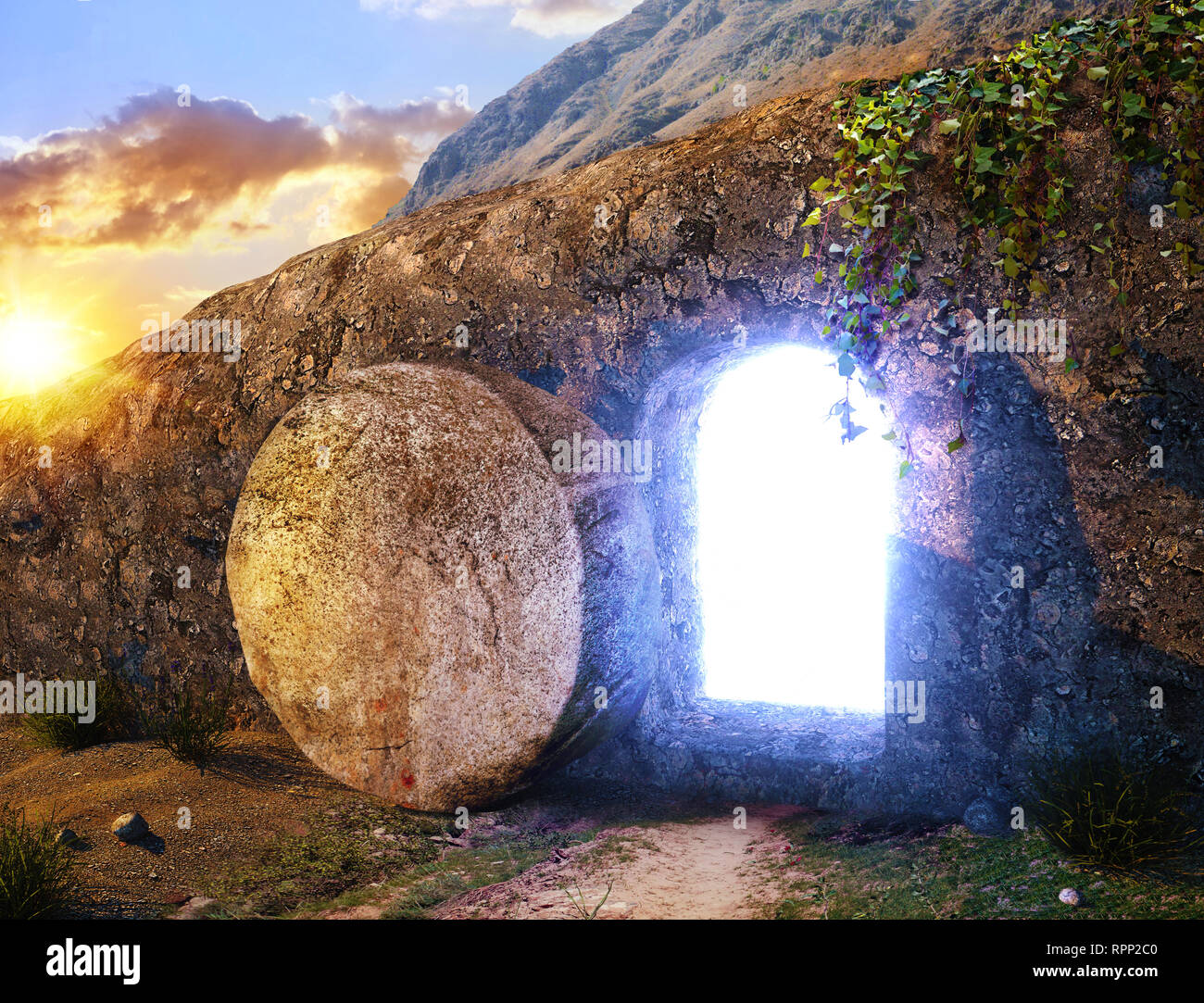 He is Risen. Crucifixion at Sunrise. Light From Within The Tomb Of Jesus. Outside view on Tomb. Stock Photo