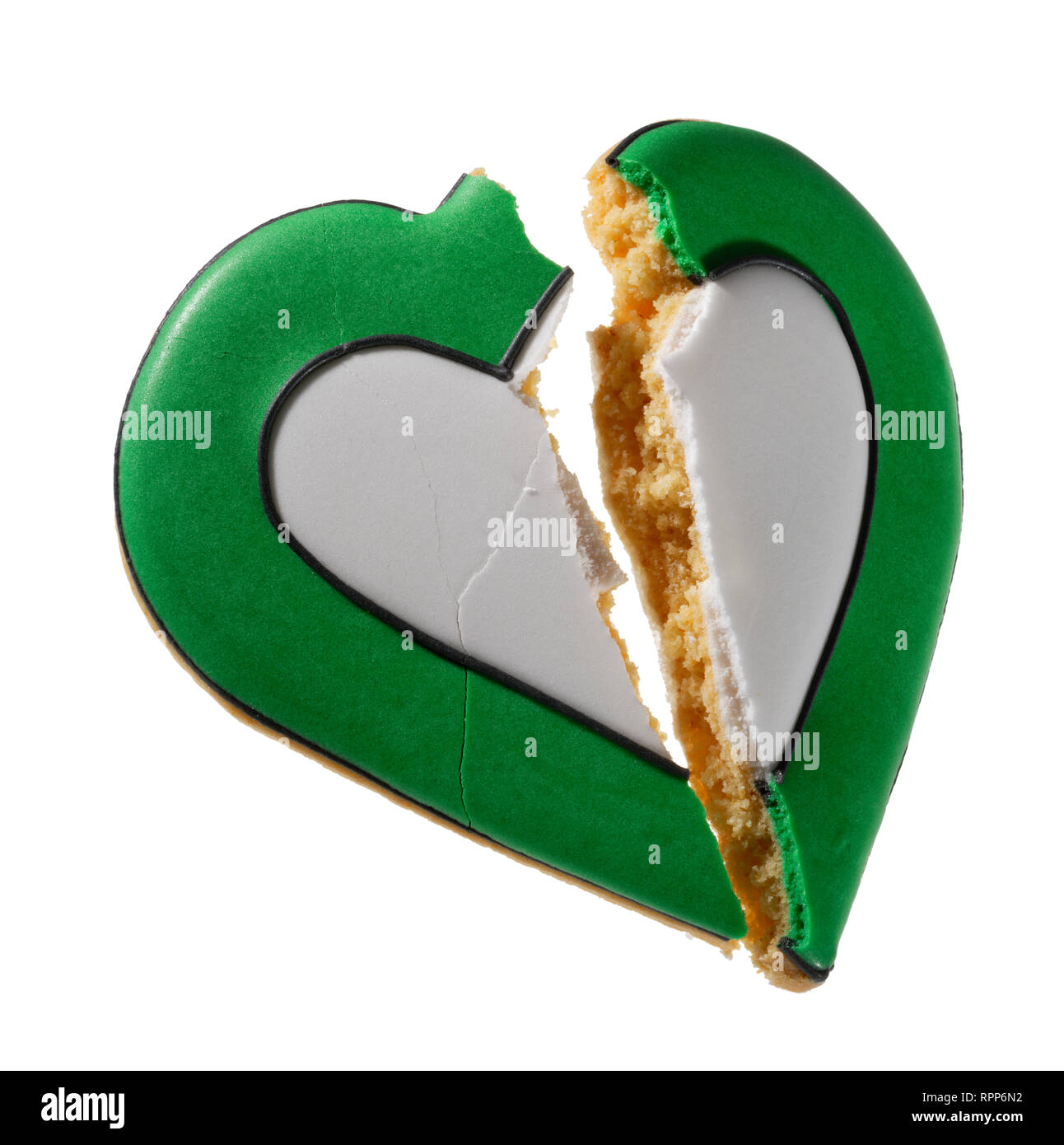 Broken heart shaped biscuit. The end of love. Grief. Stock Photo