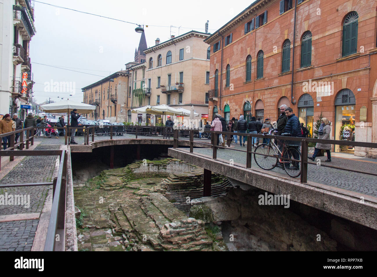 Italy, Verona - December 08 2017: the view of people on Via Leoni and Roman ruins on December 08 2017, Veneto, Italy. Stock Photo