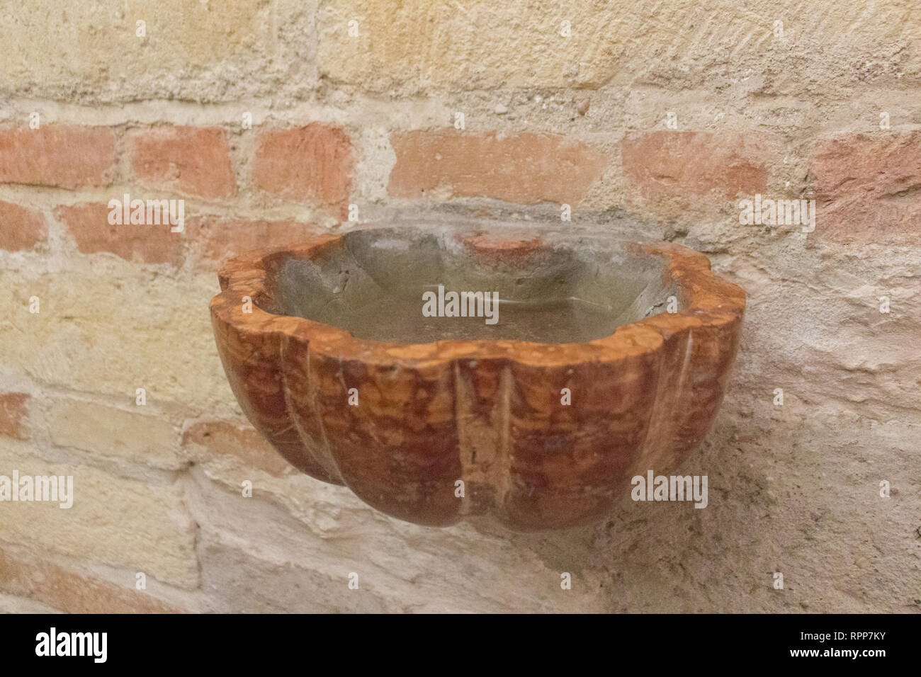The view of the Holy water bowl with water in Catholic church Stock