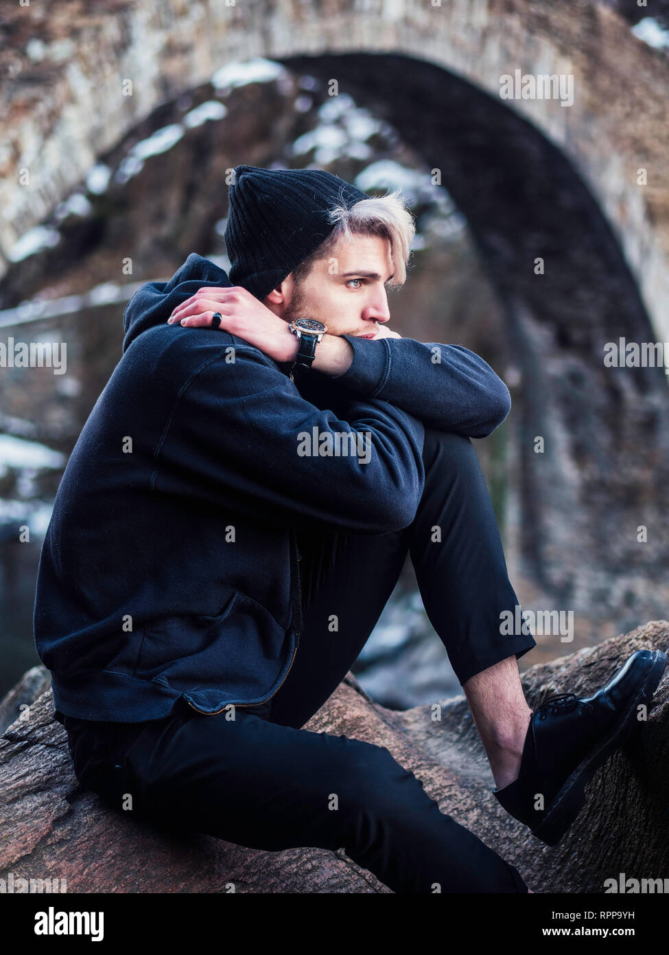 Portrait Of Young Man In Hoodie Posing Outdoor In Winter Setting With Snow  All Around, Looking At Camera. Stock Photo, Picture and Royalty Free Image.  Image 93252451.