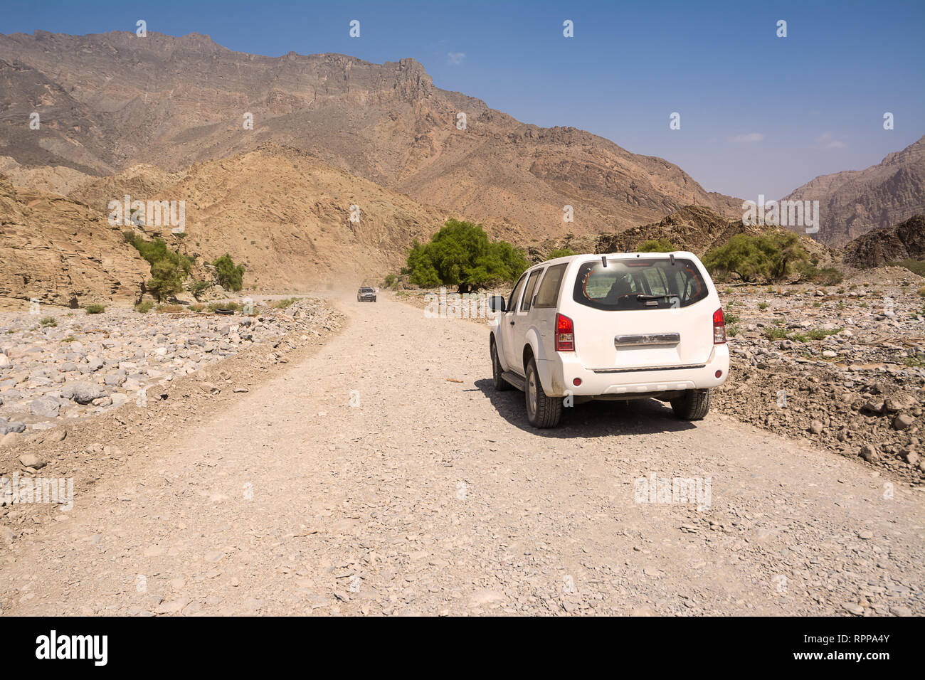 Off-road vehicle on the Jebel Shams mountains (Oman) Stock Photo