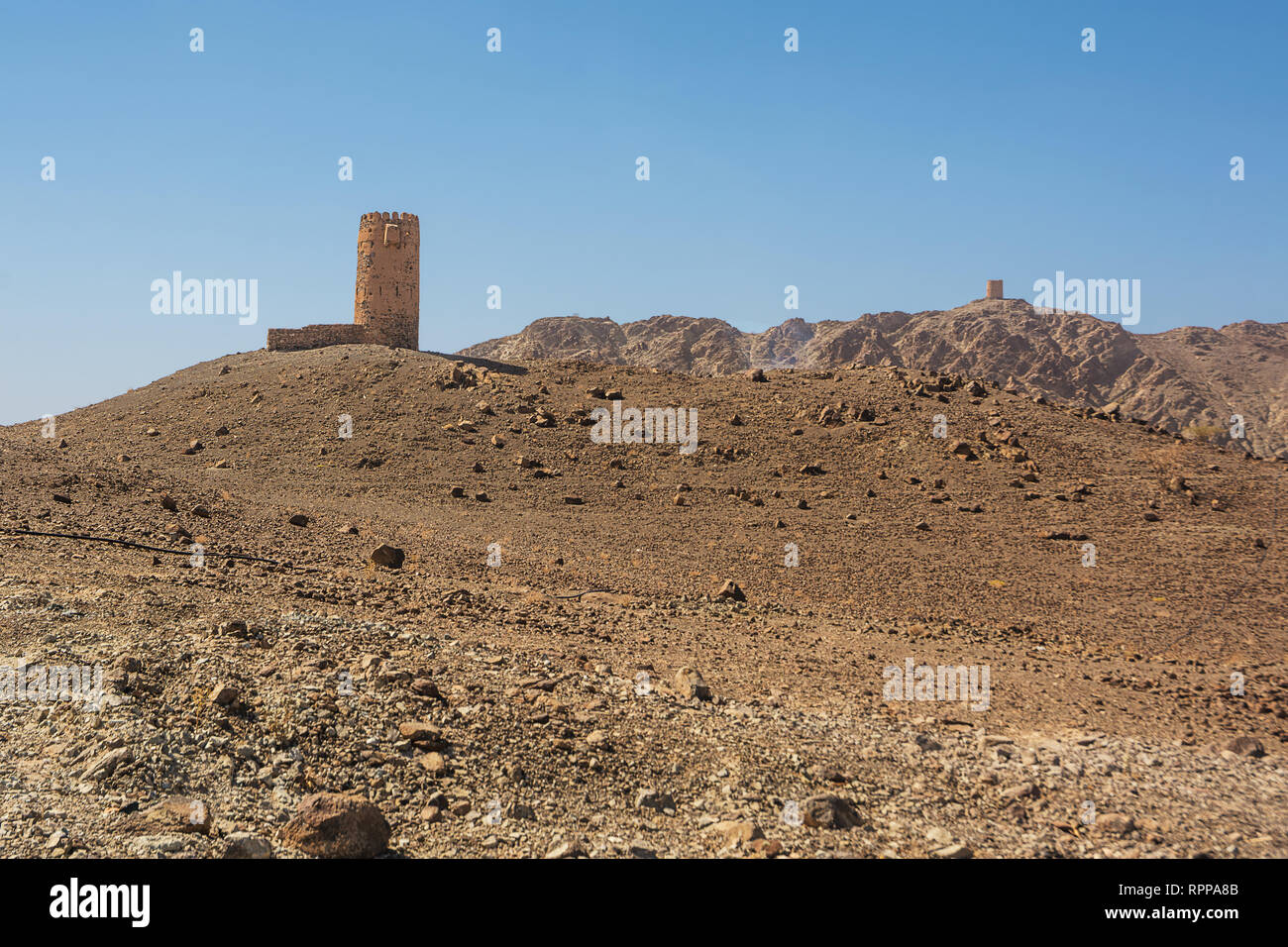Ancient tower on top of a rocky hill in Oman Stock Photo