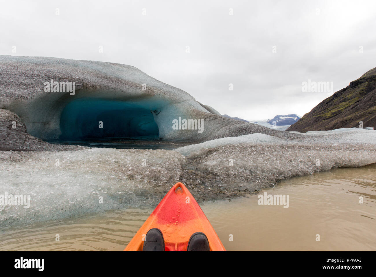 Looking out over the bow of a kayak on a glacial lake in Iceland Stock Photo