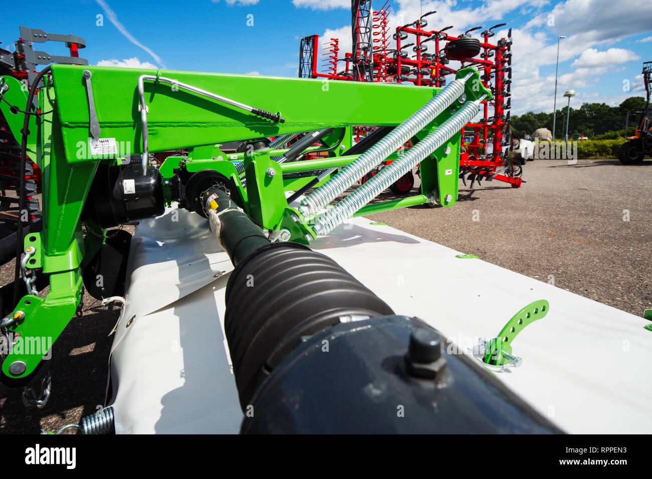 Hydraukic systems on an industrial mower coupled to a tractor. Stock Photo