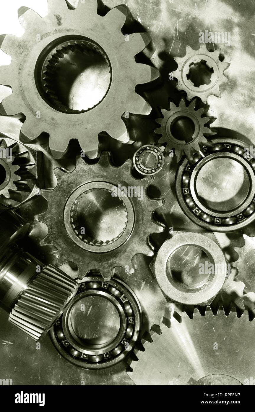 Gears and ball-bearings made of titanium and steel. Stock Photo