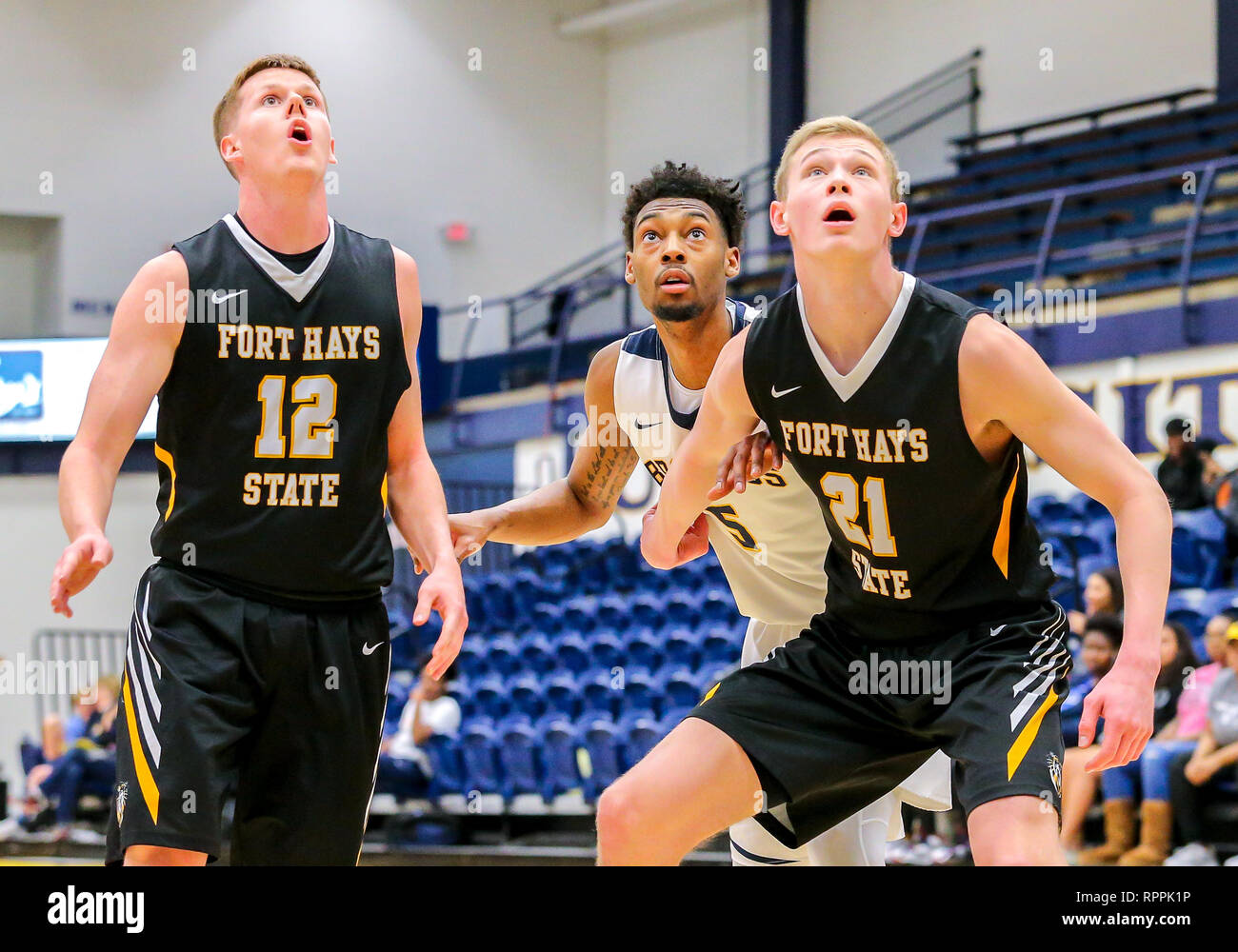 Edmond, OK, USA. 21st Feb, 2019. Fort Hays State Forward Jared Vitztum (21)  and University of Central Oklahoma Guard Jordan Hemphill (5) position for a  rebound during a basketball game between the