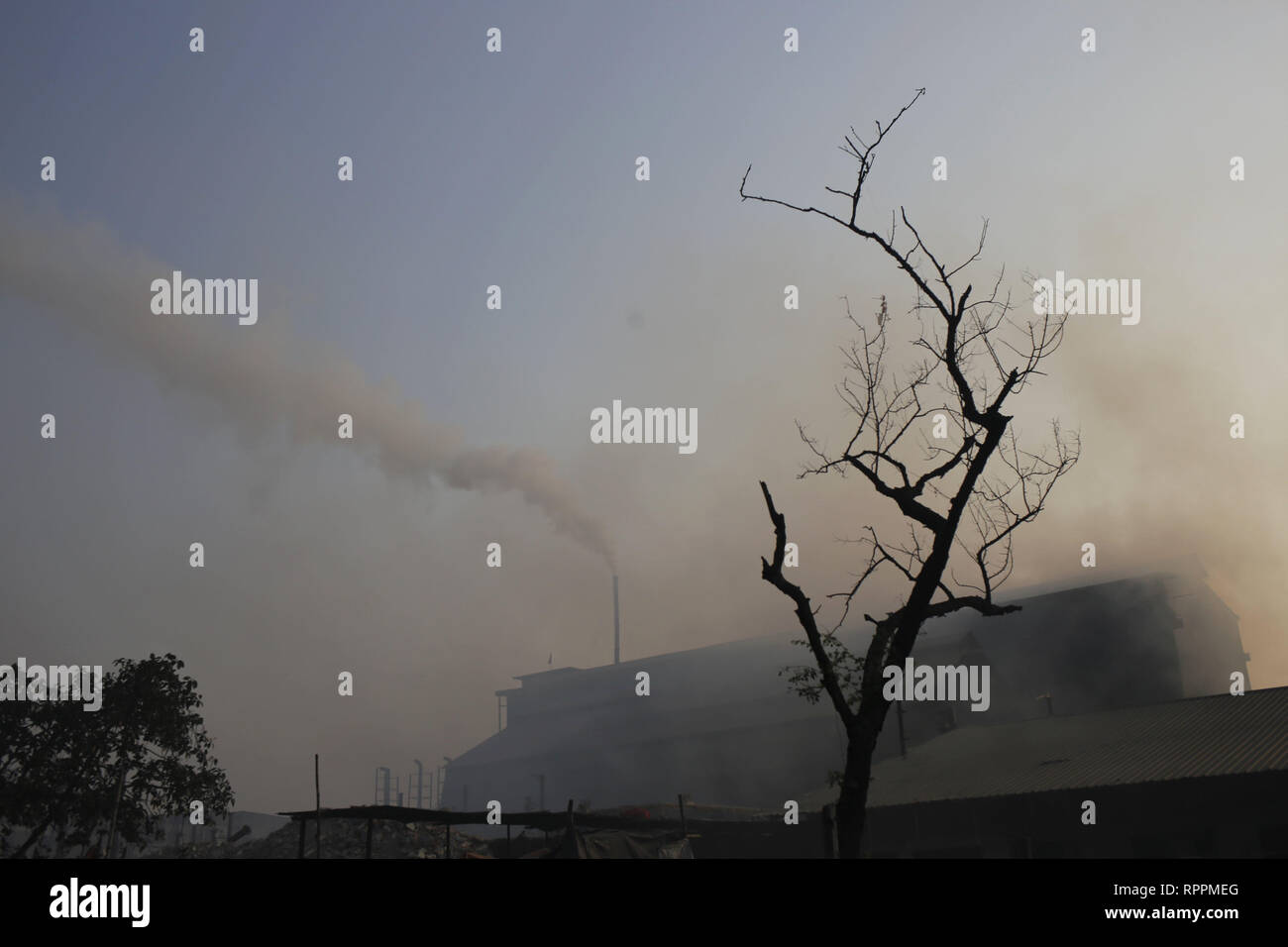 Dhaka, Bangladesh. 23rd Feb, 2019. A view of smoke out from industrial chimney near Shyampur. It's the one of the main industrial areas of Dhaka city where air quality is very poor. In the recent report Bangladesh top of the world's list the death of cause for environmental pollution related illnesses. The World Bank report says 28 per cent of the people died due to environmental pollution related illnesses. Credit: MD Mehedi Hasan/ZUMA Wire/Alamy Live News Stock Photo