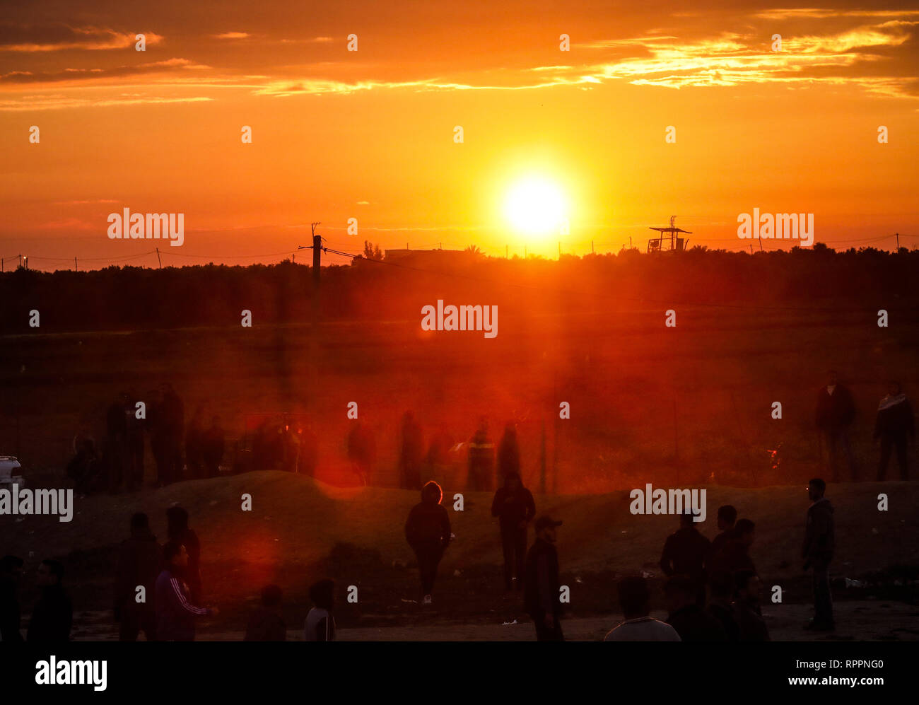 Gaza, Gaza, Gaza. 22nd Feb, 2019. Palestinians seen under sunset during clashes following the ''Great March of Return'' demonstration in Shuja'iyya neighborhood of Gaza City, Gaza. Credit: Nidal Alwaheidi/SOPA Images/ZUMA Wire/Alamy Live News Stock Photo