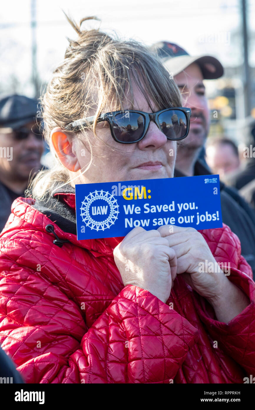 Warren, Michigan, USA. 22nd Feb 2019.  The United Auto Workers union holds a prayer vigil at General Motors' Warren Transmission plant to protest the planned closure of the facility. GM says it will close five factories in the United States and Canada, putting thousands out of work. Karen Huffman, a member of UAW Local 22, holds a bumper sticker. Credit: Jim West/Alamy Live News Stock Photo