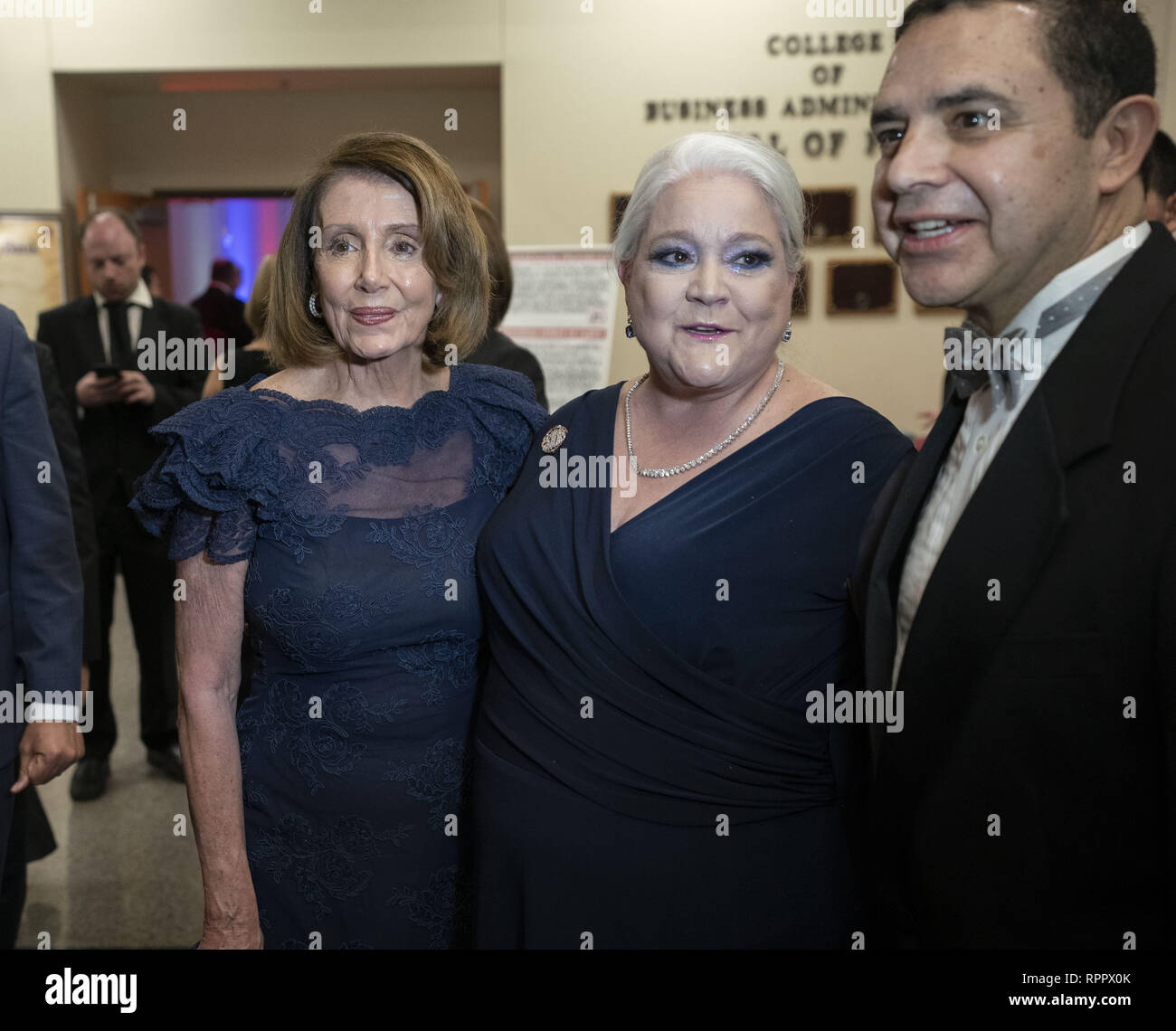 Laredo, TX, USA. 22nd Feb, 2019. Laredo, Texas Feb. 22, 2019: House Speaker Nancy Pelosi poses with guests at the Los Caballeros de la Republica del Rio Grande cocktail party as an honored guest of the George Washington's Birthday celebration in this border city. Pelosi toured the Rio Grande River earlier in the day. At right is Congressman Henry Cuellar, D-Laredo. Credit: Bob Daemmrich/ZUMA Wire/Alamy Live News Stock Photo