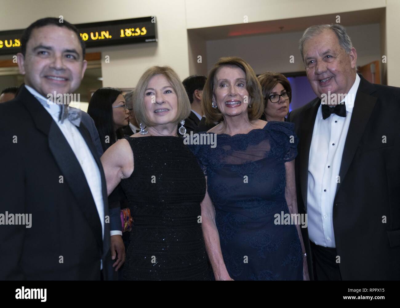 Laredo, TX, USA. 22nd Feb, 2019. Laredo, Texas Feb. 22, 2019: House Speaker Nancy Pelosi poses with guests at the Los Caballeros de la Republica del Rio Grande cocktail party as an honored guest of the George Washington's Birthday celebration in this border city. Pelosi toured the Rio Grande River earlier in the day. At left is Congressman Henry Cuellar, D-Laredo. Credit: Bob Daemmrich/ZUMA Wire/Alamy Live News Stock Photo