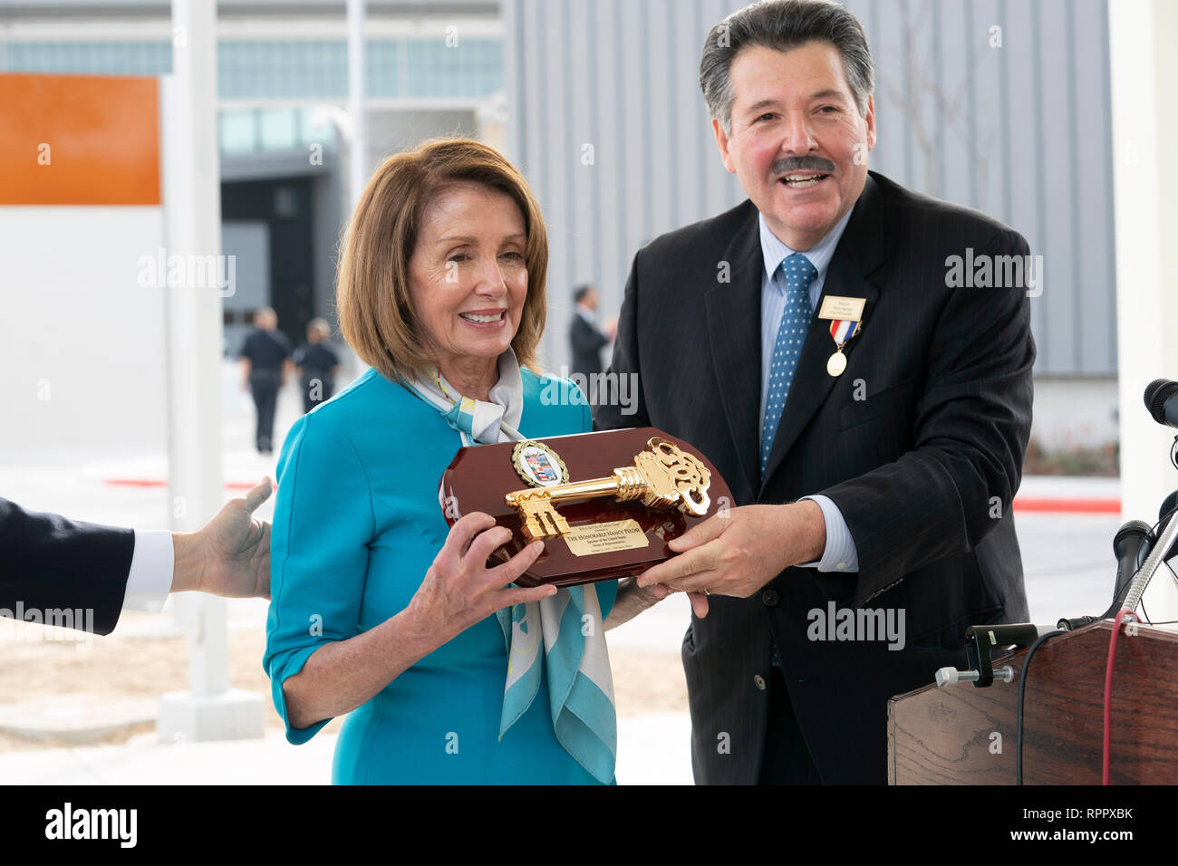 United States House of Representatives Speaker Nancy Pelosi (D-CA), receives a key to the city from Laredo Mayor Pete Saenz, right, as Laredo Congressman Henry Cuellar applauds during a press conference at the border between Laredo and Nuevo Laredo, Tamaulipas, Mexico. Stock Photo