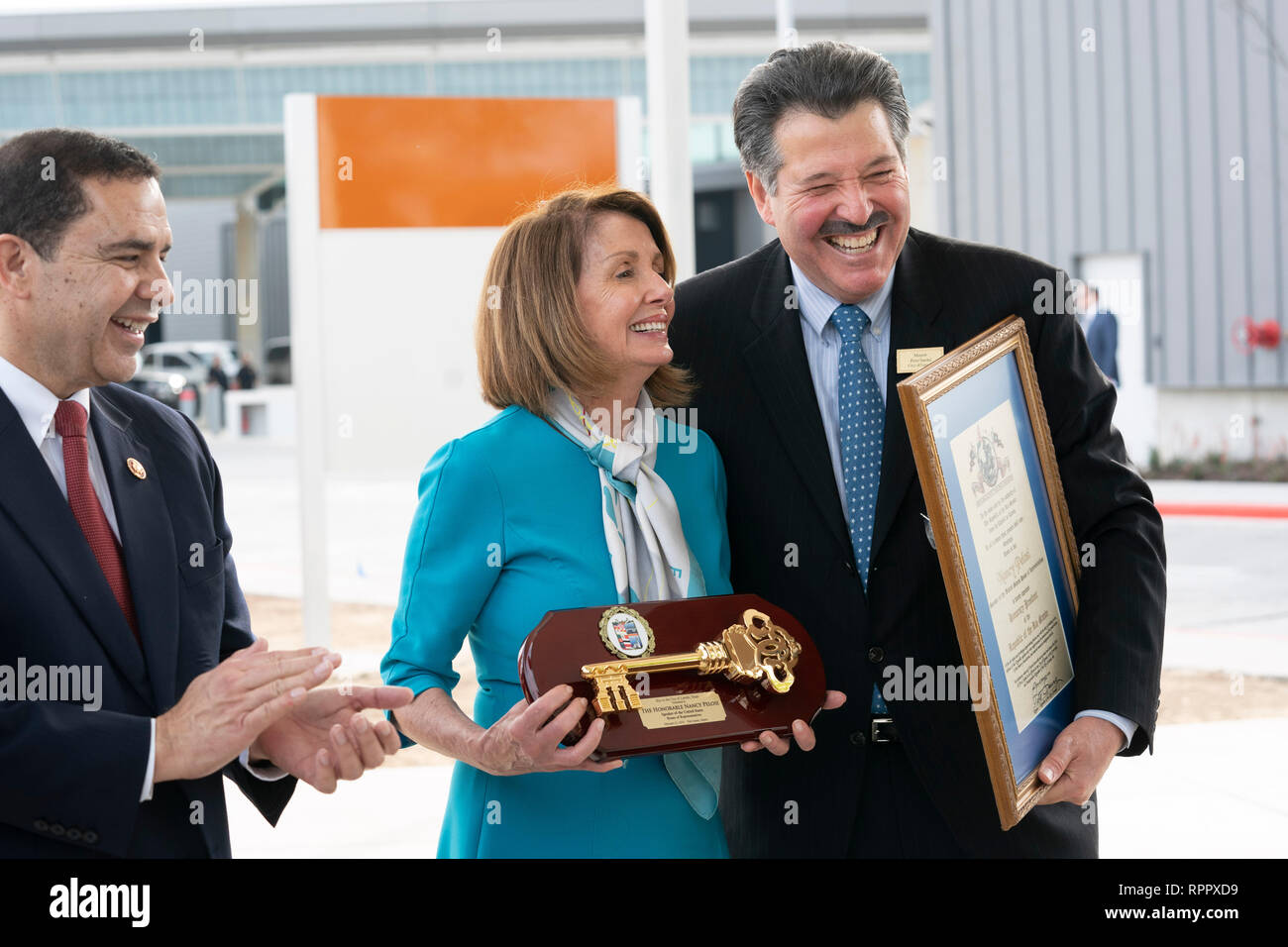 United States House of Representatives Speaker Nancy Pelosi (D-CA), receives a key to the city from Laredo Mayor Pete Saenz, right, as Laredo Congressman Henry Cuellar applauds during a press conference at the border between Laredo and Nuevo Laredo, Tamaulipas, Mexico. Stock Photo