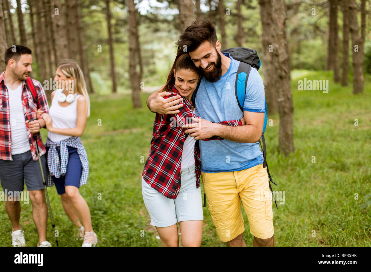 Four friends hiking through hi-res stock photography and images - Alamy