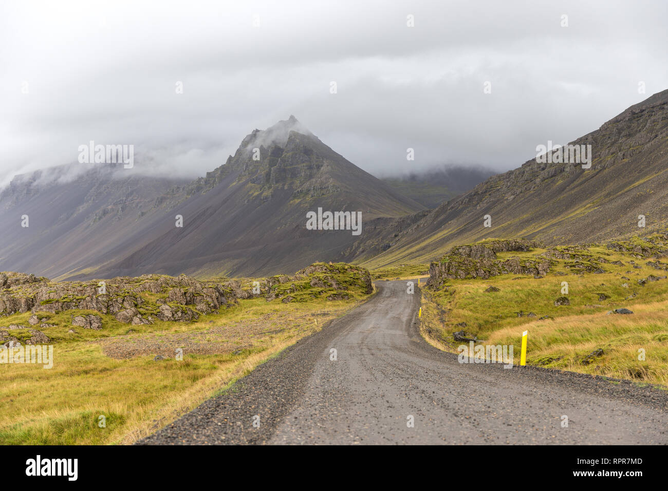 Dirt road hugging the mountains in Iceland Stock Photo