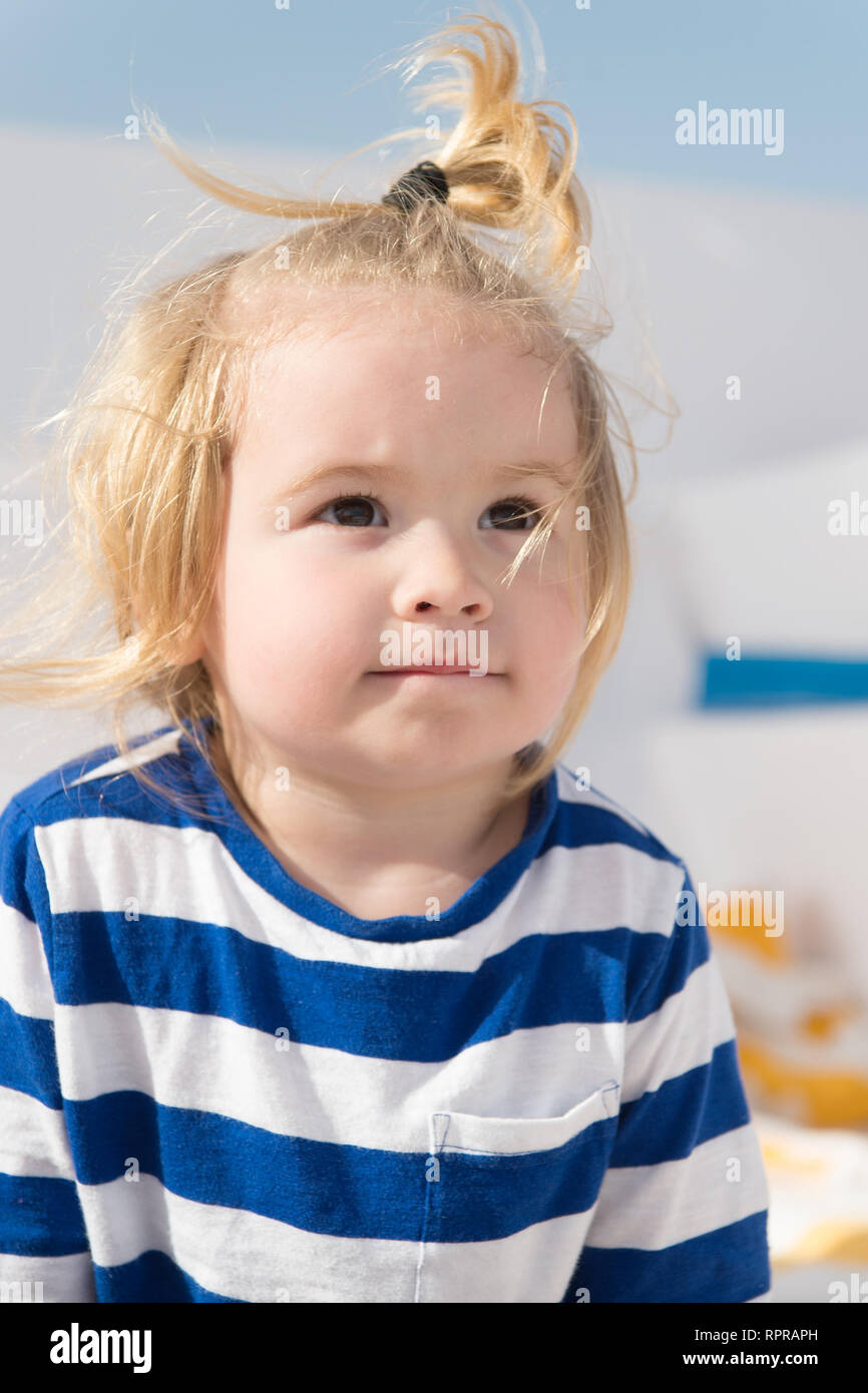 Small Baby Boy Or Cute Child With Adorable Face And Blonde Hair In