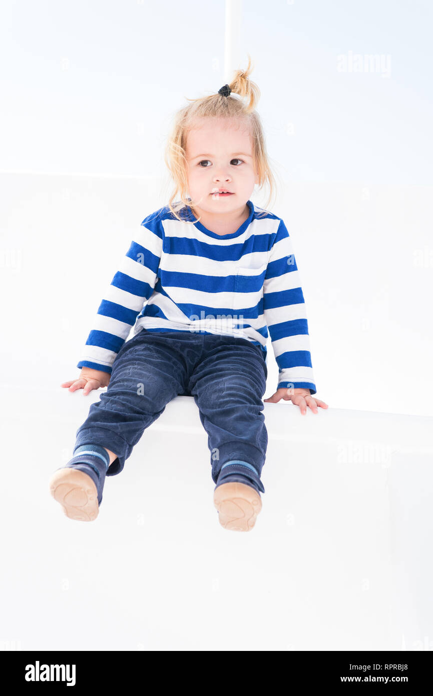 Small Baby Boy Or Cute Child With Adorable Face And Blonde Hair In