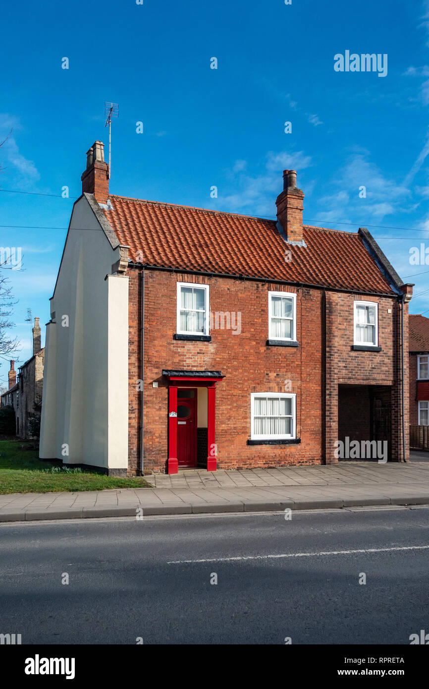 English Village Red Brick detached house with Red Door in Market Place, Tickhill in the