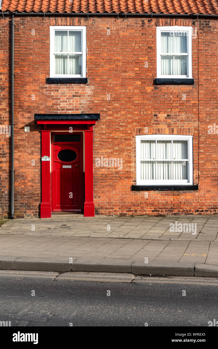 English Village Red Brick detached house with Red Door in Market Place, Tickhill in the