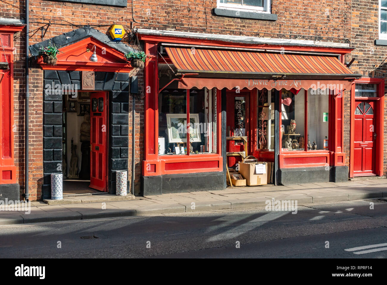 English Village Shop Front, Red double fronted Davie Fine Art gallery shop in Market Place