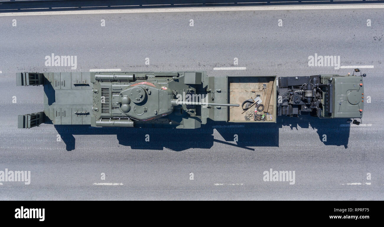 Returning from the Red Square after the Victory Day parade, the KamAZ-65225 truck carries the T-34-85 tank, from above. Stock Photo