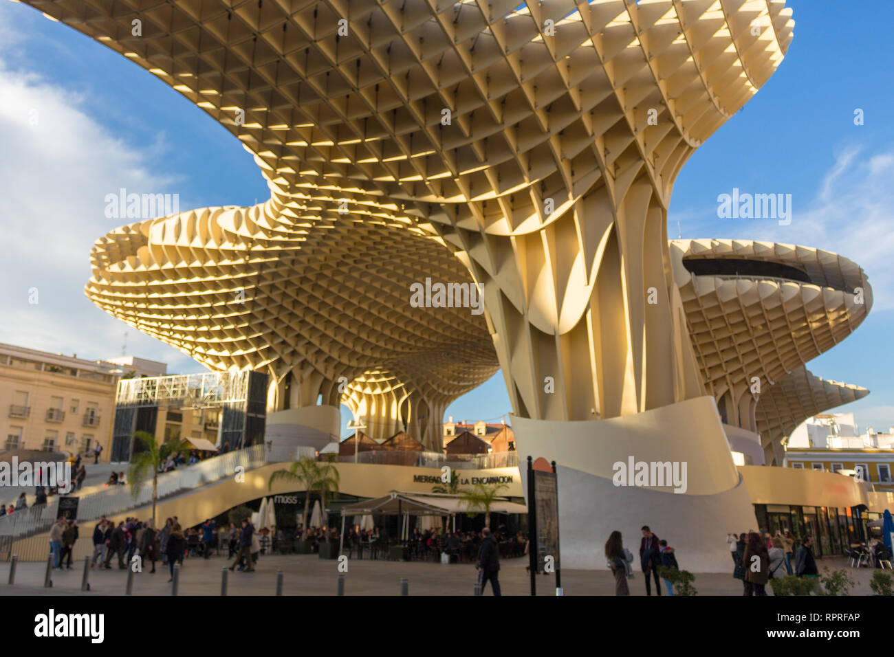 December afternoon at the Metropol Parasol in downtown Seville with the typical Spanish lifestyle of enjoying life outside with friends and family Stock Photo