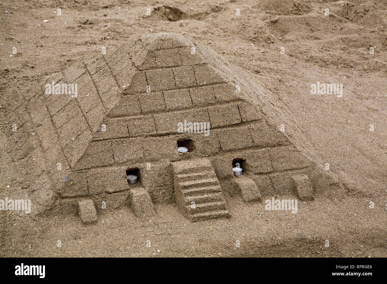 Close-up of an Egyptian pyramid shaped sandcastle Stock Photo