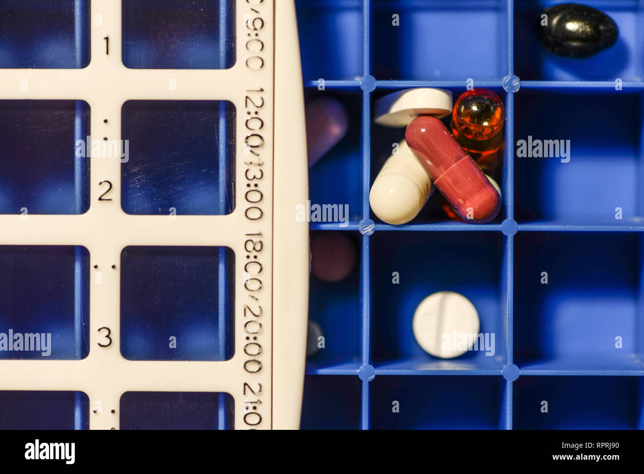 Pills in box with dates. Different medicines separated per dates and