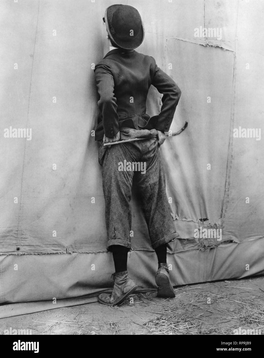 Charlie Chaplin The Circus 1928 classic pose  at circus tent Charles Chaplin Productions / United Artists Stock Photo