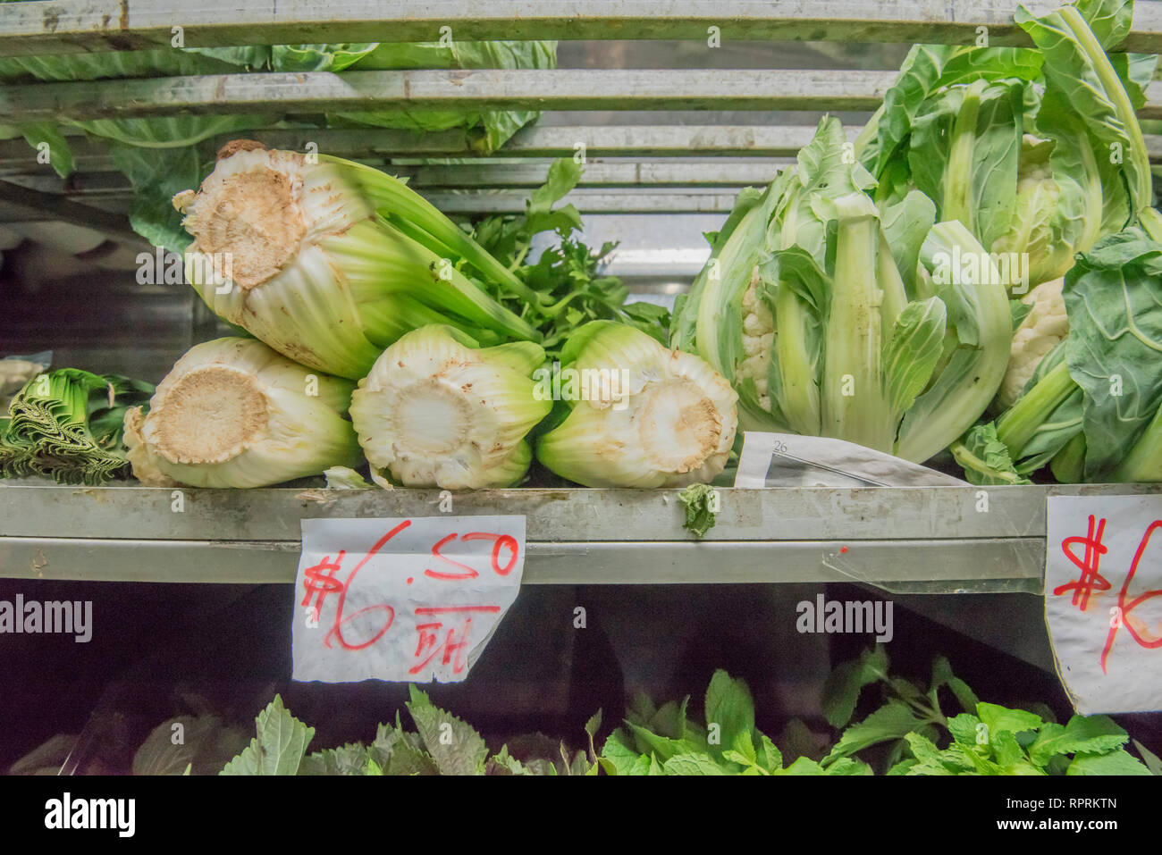 Fresh cut green root vegetables for sale in a supermarket or grocery store in the Sydney suburb