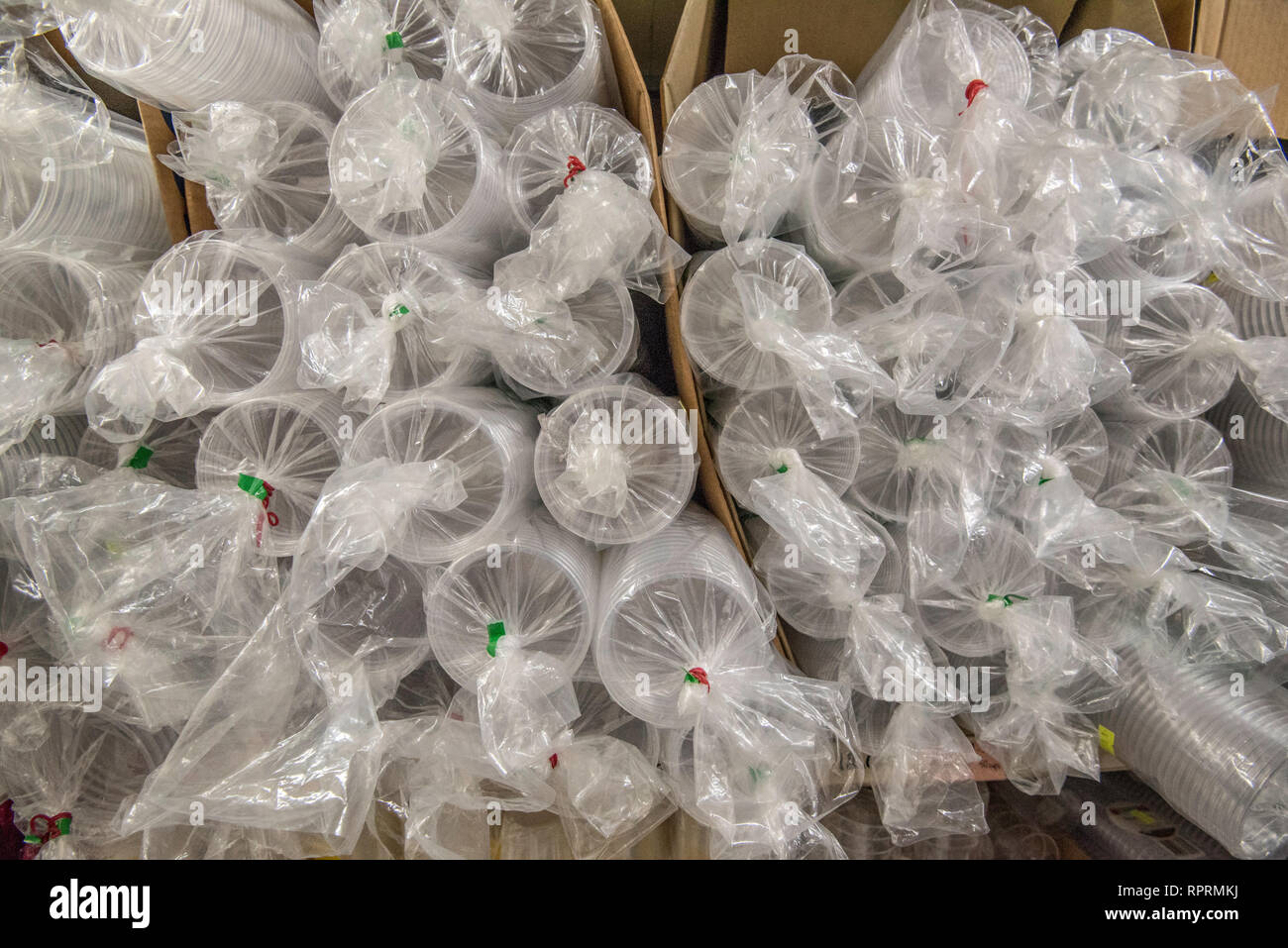 Plastic cups stacked in an Asian grocery supermarket store in the