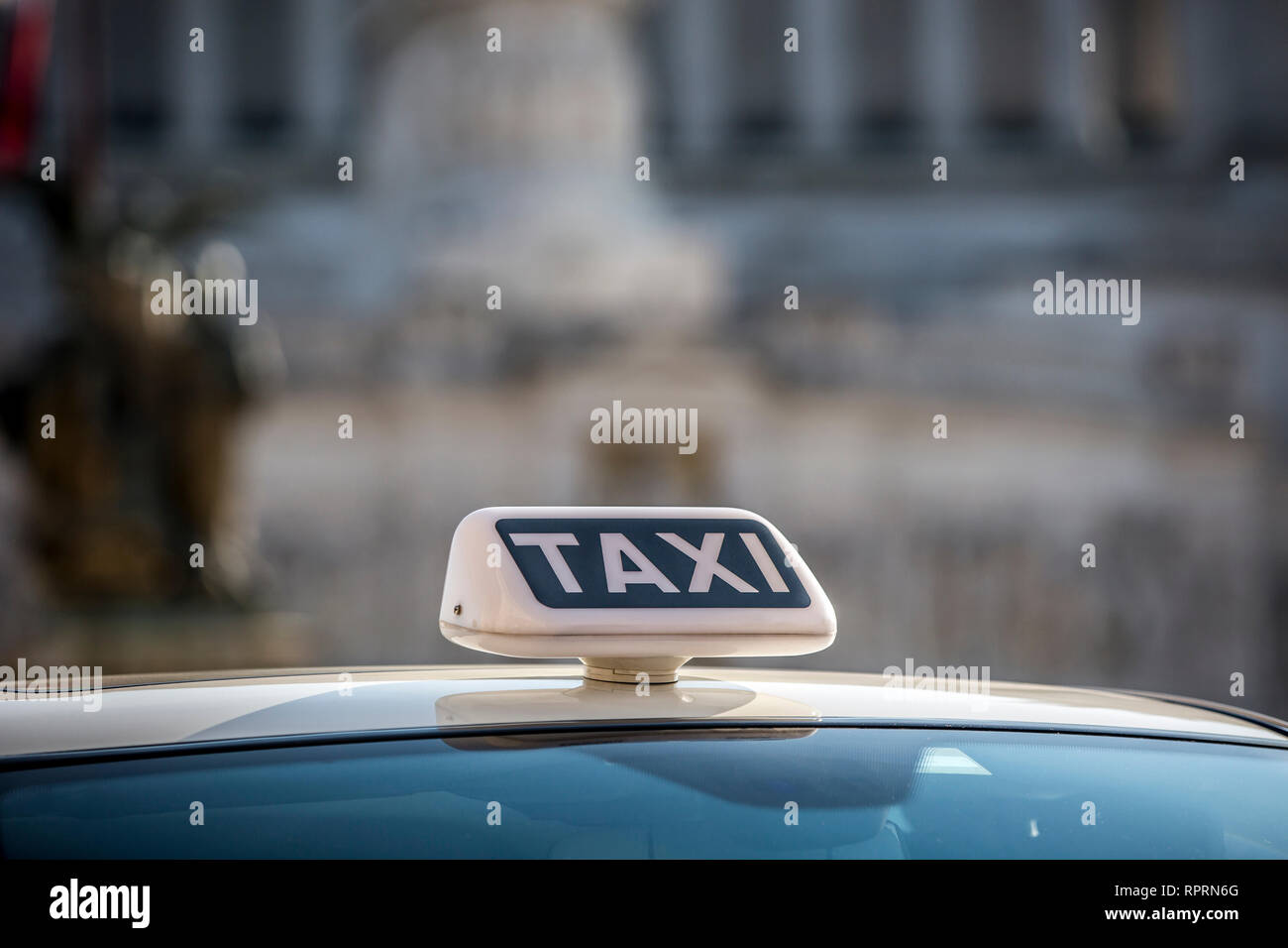 Taxi sign on the roof of a vehicle Stock Photo Alamy