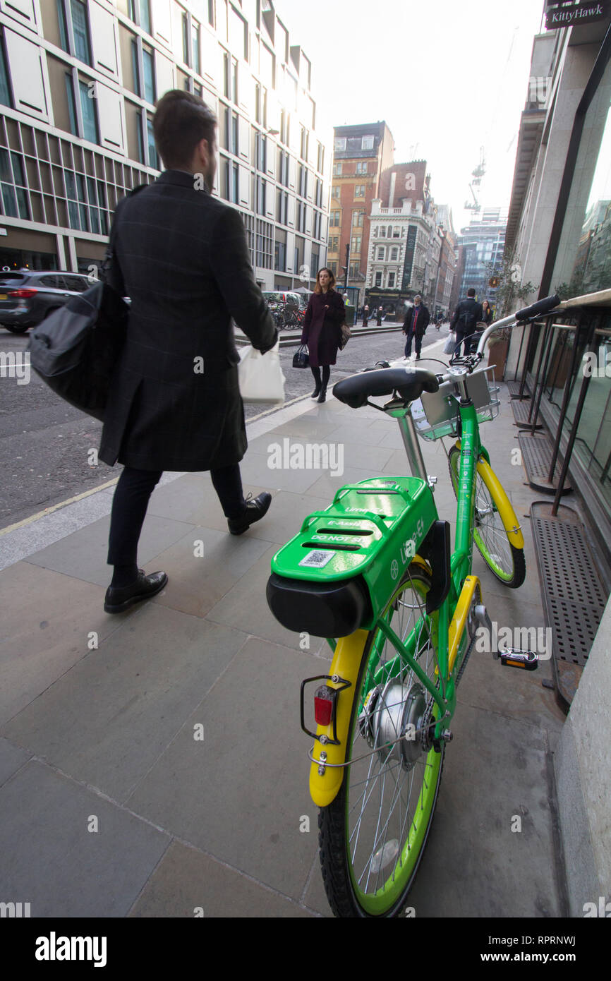 Lime ebike electric hire bike bicycle London, parked on pavement in The