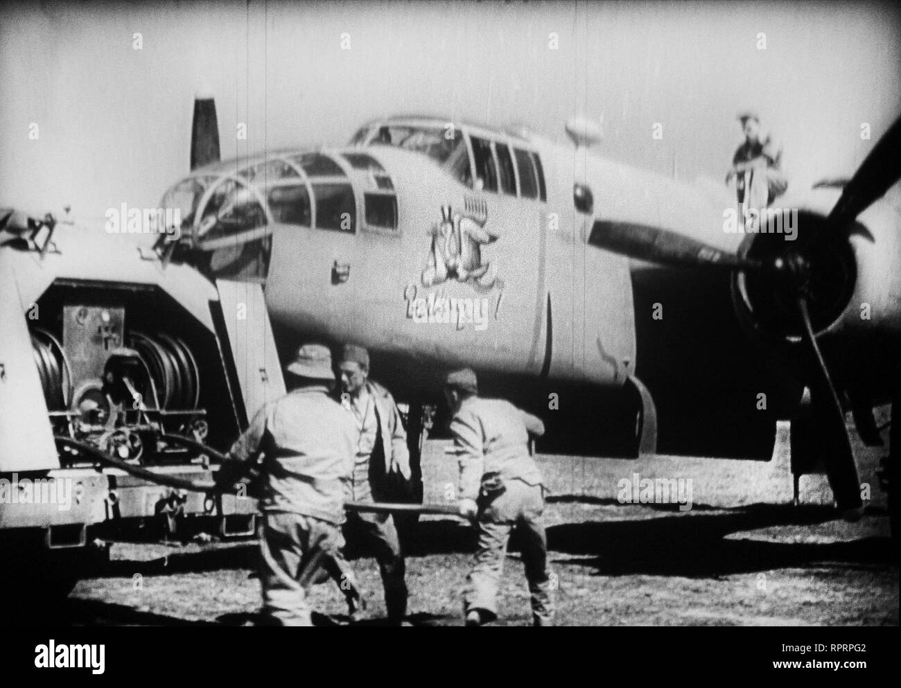 Team of american soldiers fills a military plane. Stock Photo