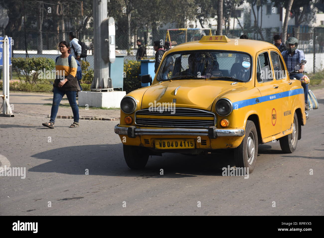 Hindustan Ambassador yellow diesel taxi in Kolkata, India. Stock Photo