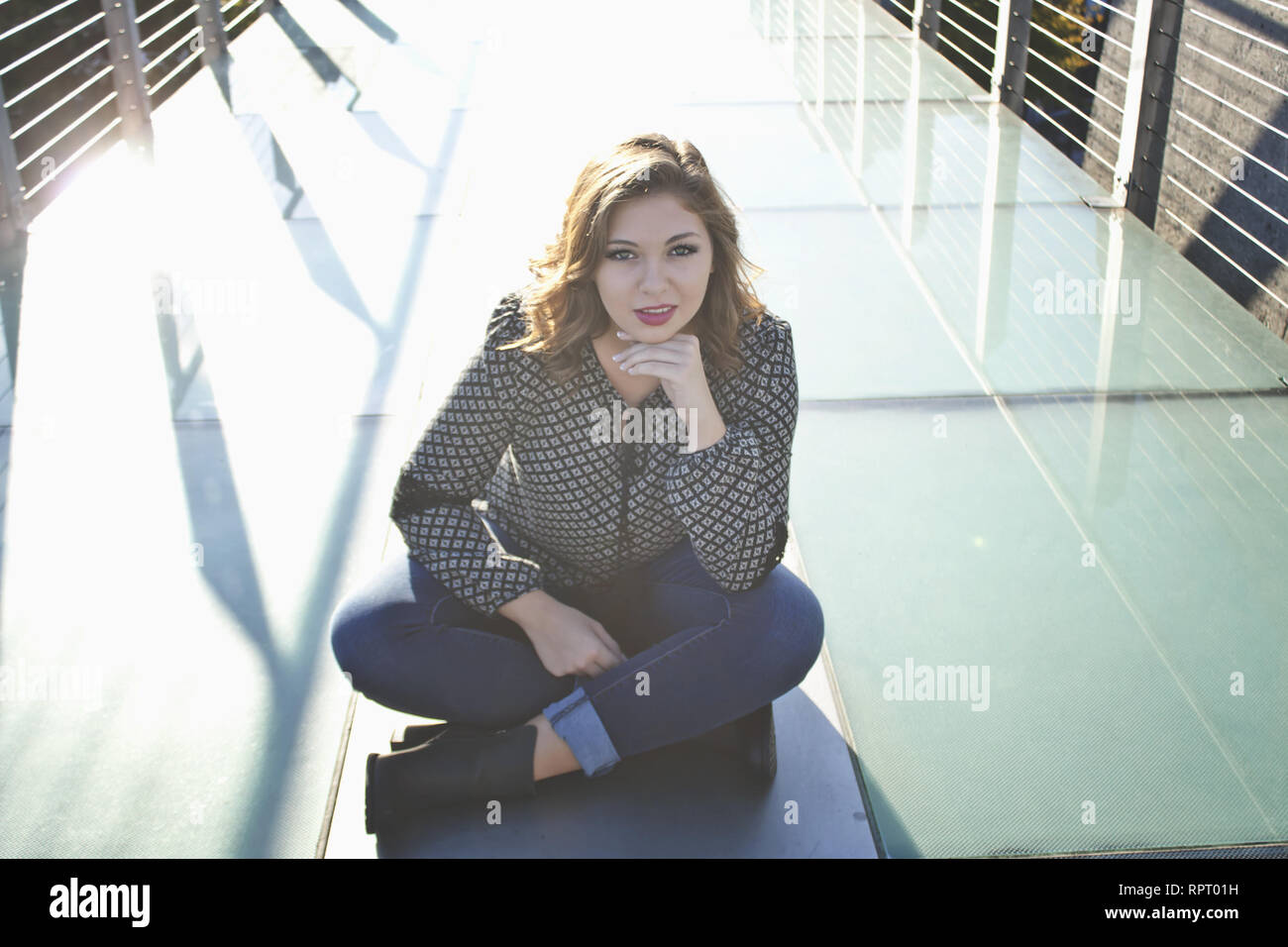 Woman sitting on bridge posing photo – Free Cherkassy Image on Unsplash