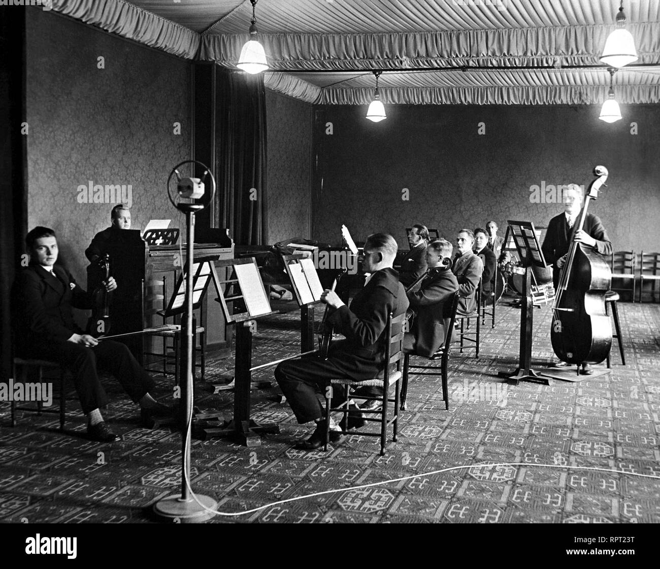 The Finnish Broadcasting Company Radio Orchestra in 1927 playing at The Aleksanterinkatu studio. Stock Photo