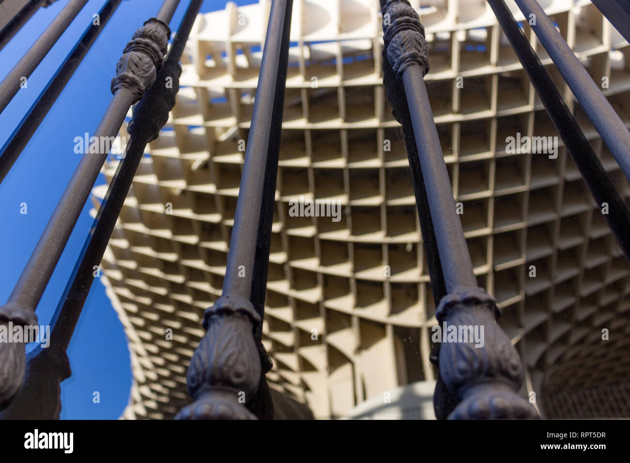 reflections of a wooden structure in a window behind bars Stock Photo ...