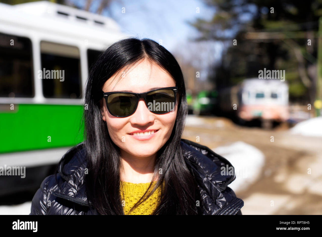 Chinese woman wearing blue sunglasses hires stock photography and