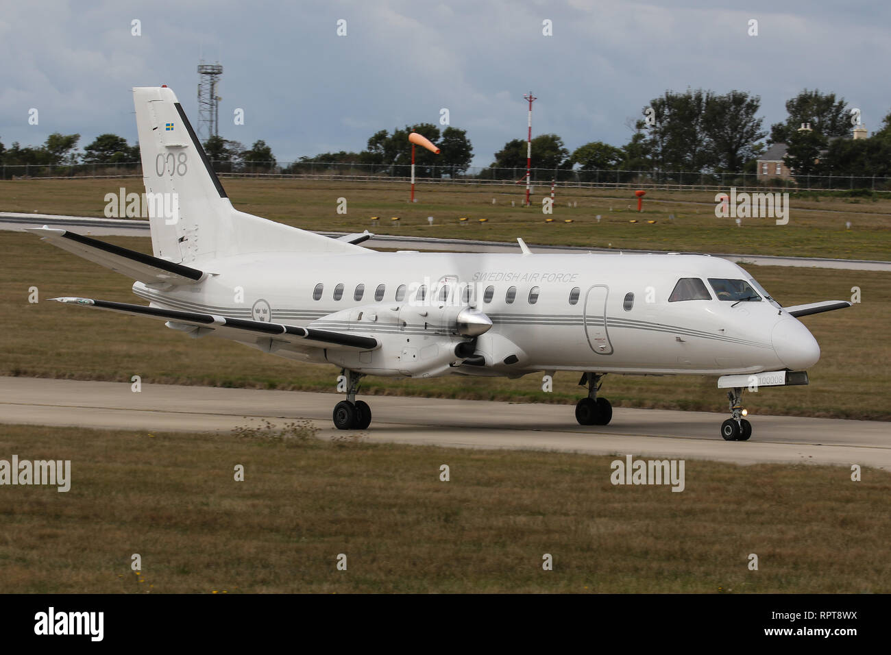 A Saab 340 (008), operated by the Swedish Air Force takes-off from Jersey Airport Stock Photo