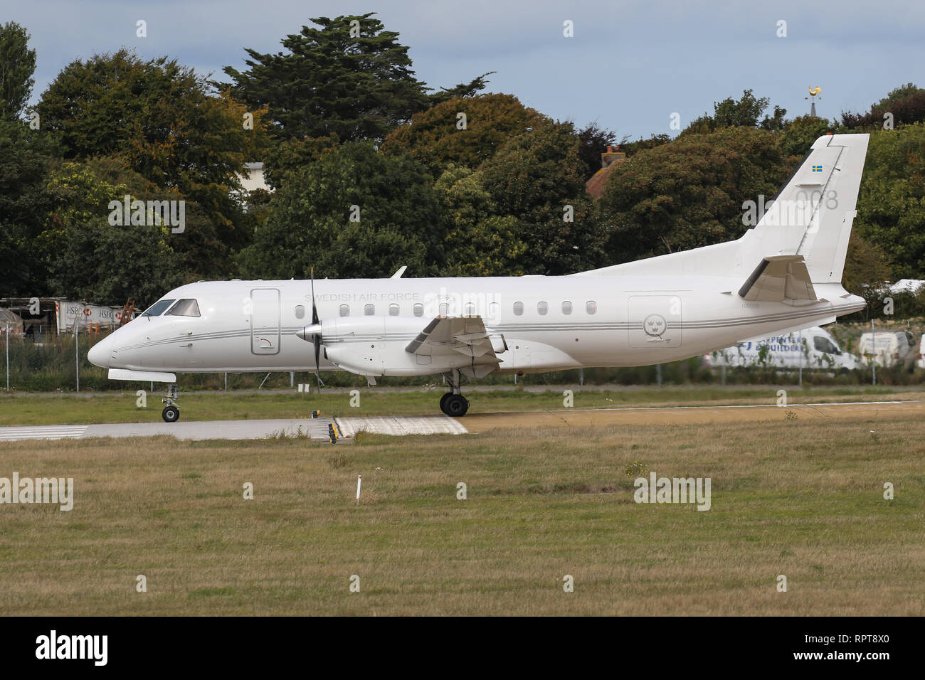 A Saab 340 (008), operated by the Swedish Air Force takes-off from Jersey Airport Stock Photo