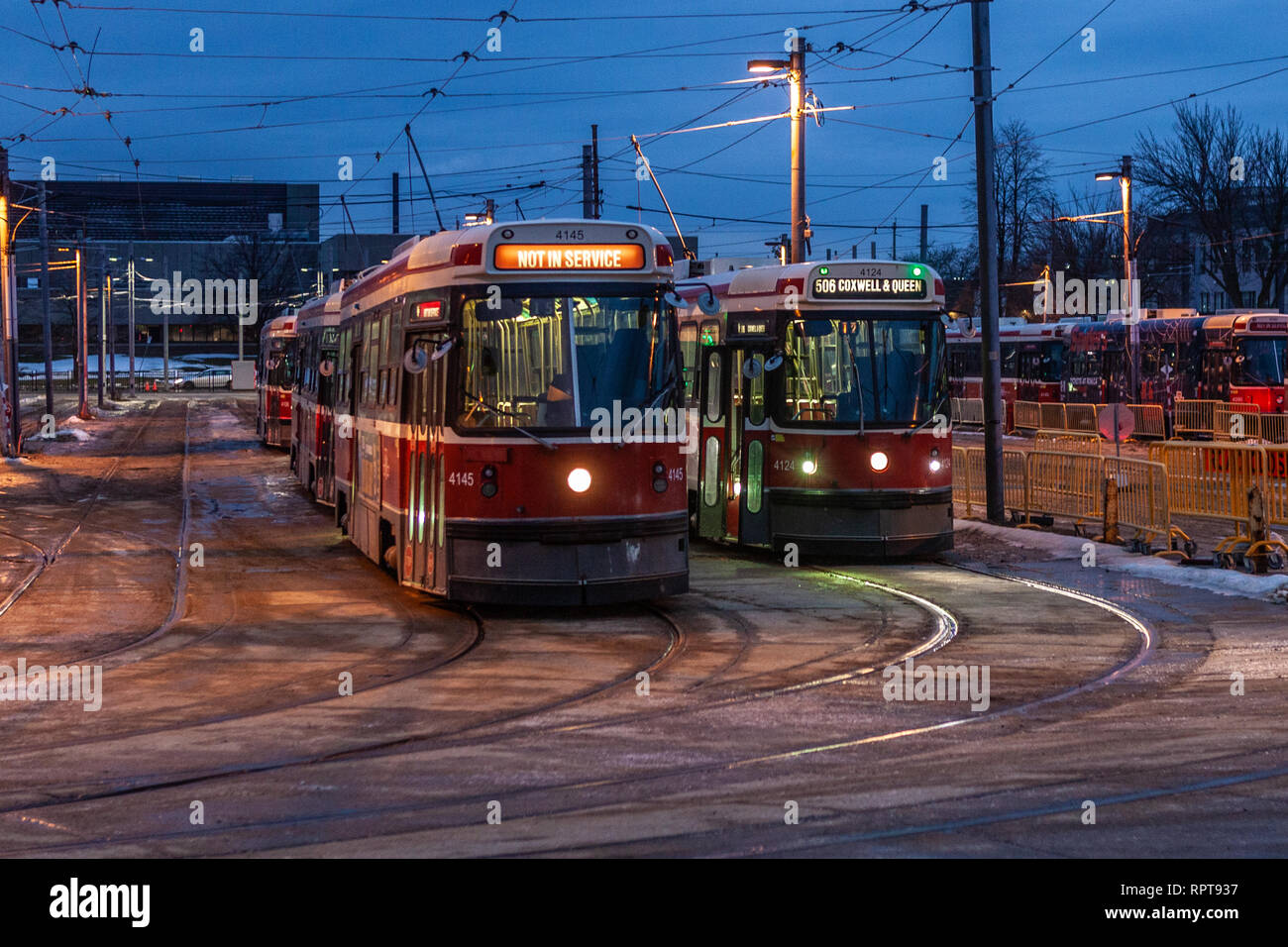 Classical streetcars in downtown Toronto, Lesliewille depo with view of overhead wiring and trolley poles. Busy urban landscape - Image Stock Photo