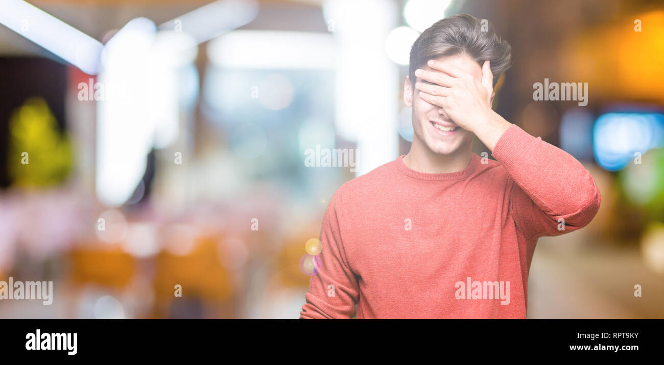Young handsome man over isolated background smiling and laughing with ...