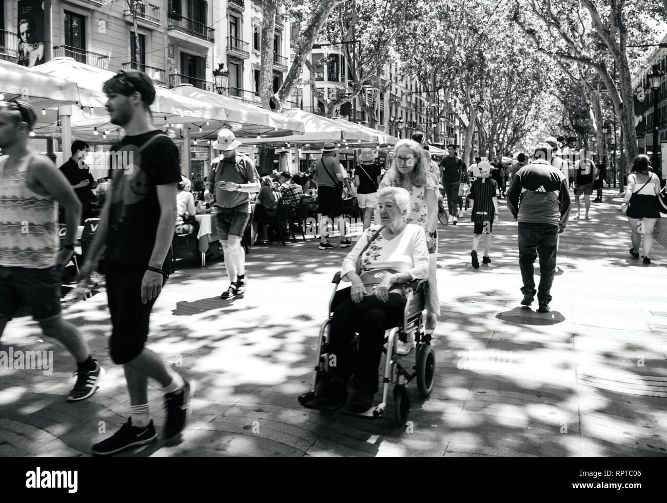 BARCELONA, SPAIN JUN 1, 2018 Locals and tourists in central Barcelona walking on the iconic