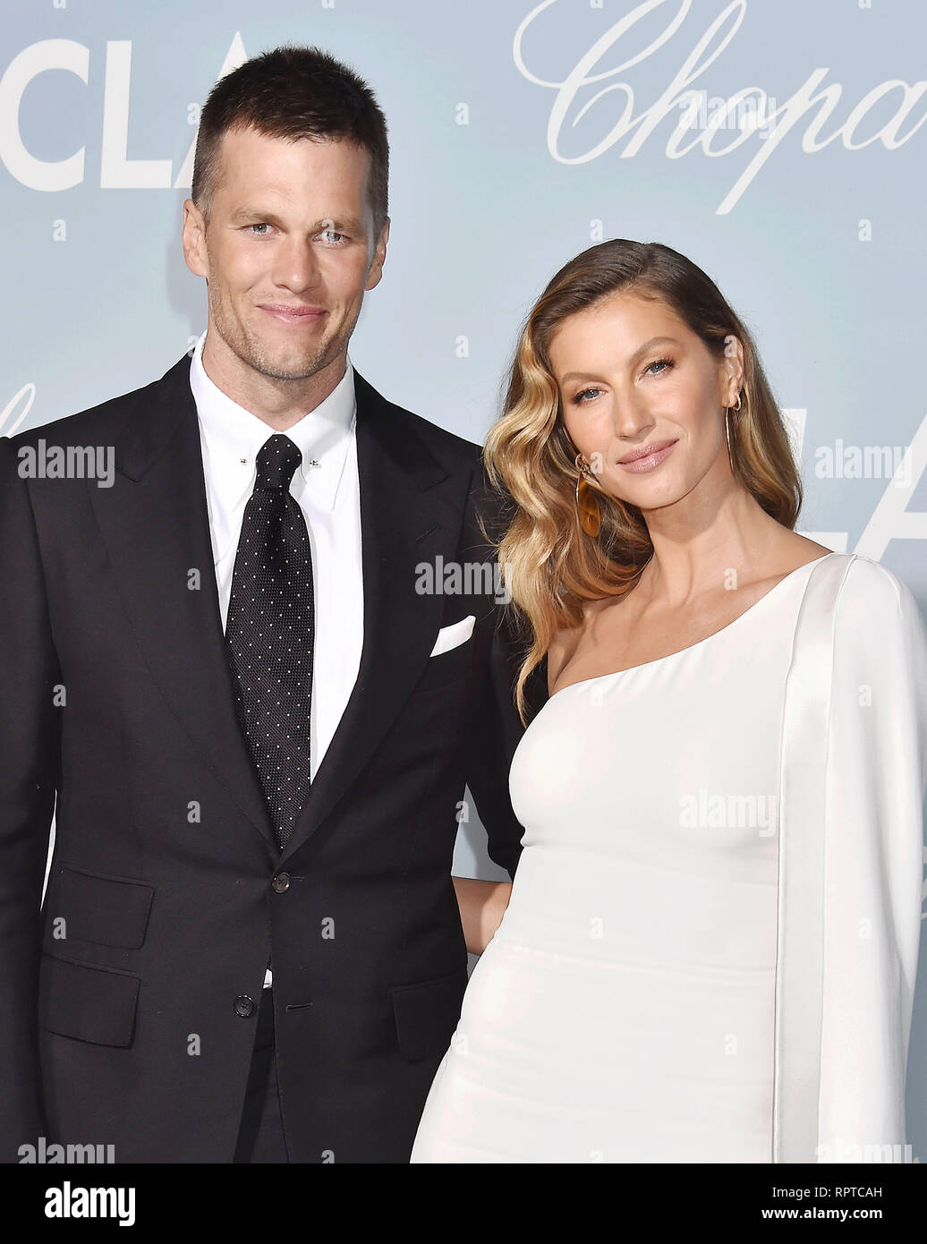 LOS ANGELES, CA - FEBRUARY 21: Tom Brady (L) and Gisele Bündchen arrive at the Hollywood For Science Gala at Private Residence on February 21, 2019 in Stock Photo
