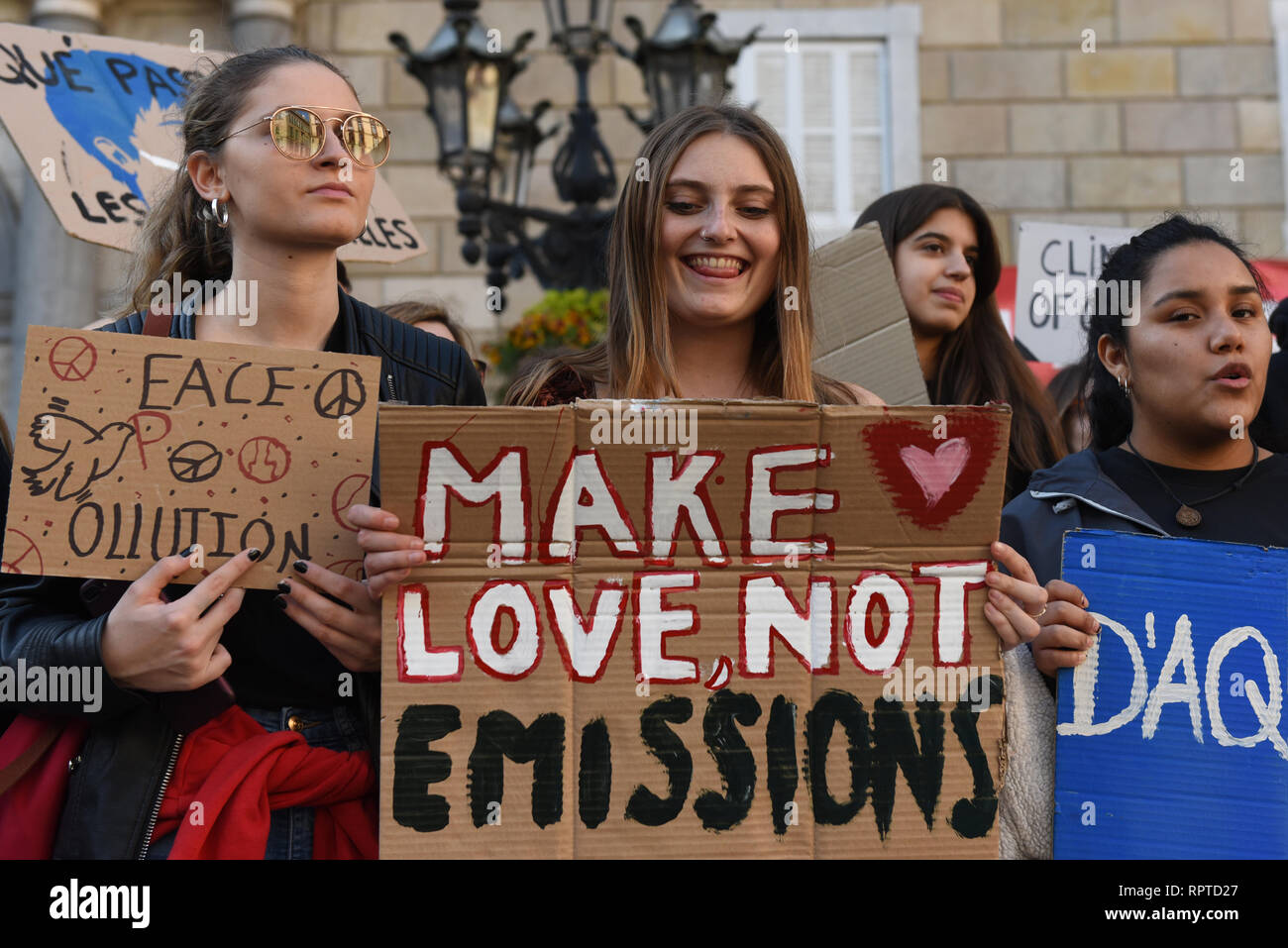People are seen holding placards during the protest. Dozens of young people gathered in central Barcelona to protest against the government’s lack of action on the climate change and destruction of the environment. Stock Photo