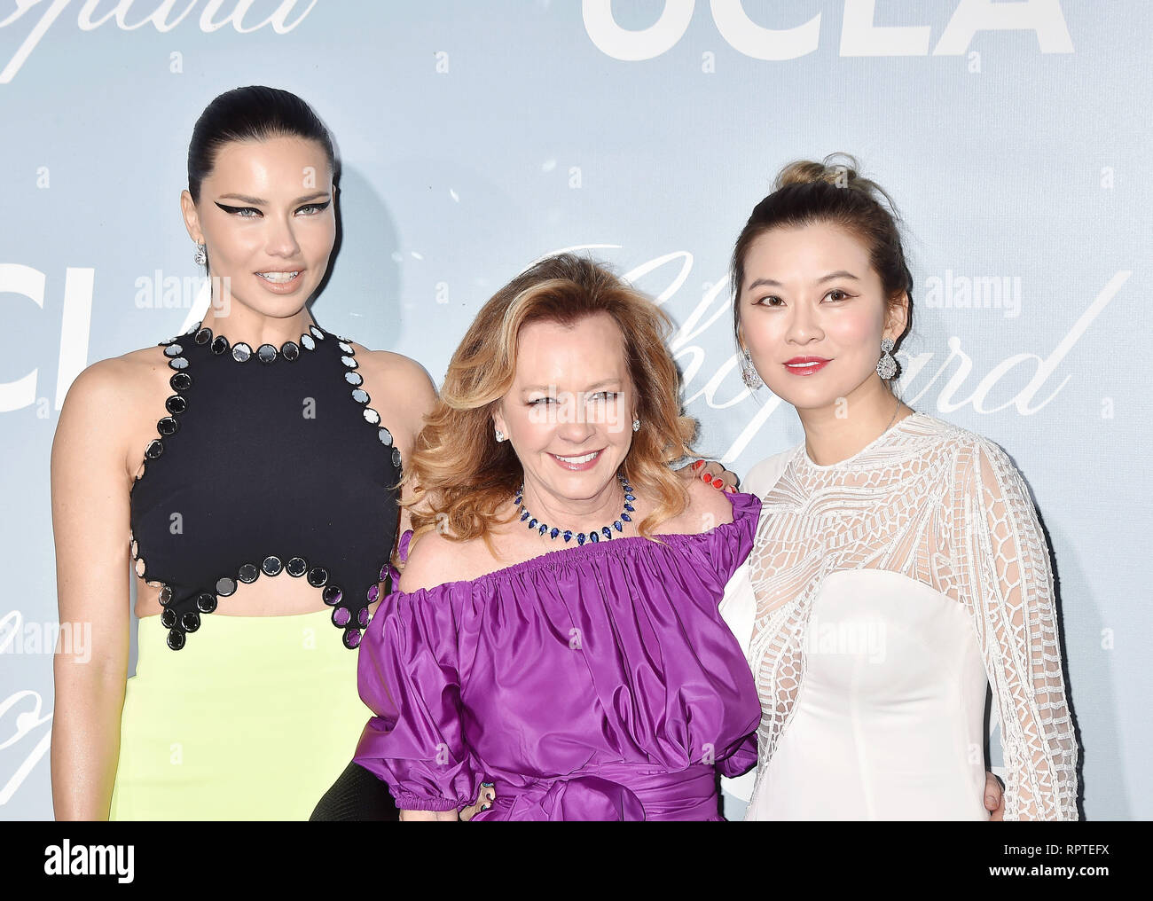 LOS ANGELES, CA - FEBRUARY 21: (L-R) Adriana Lima, Caroline Scheufele and guest arrive at the Hollywood For Science Gala at Private Residence on Febru Stock Photo