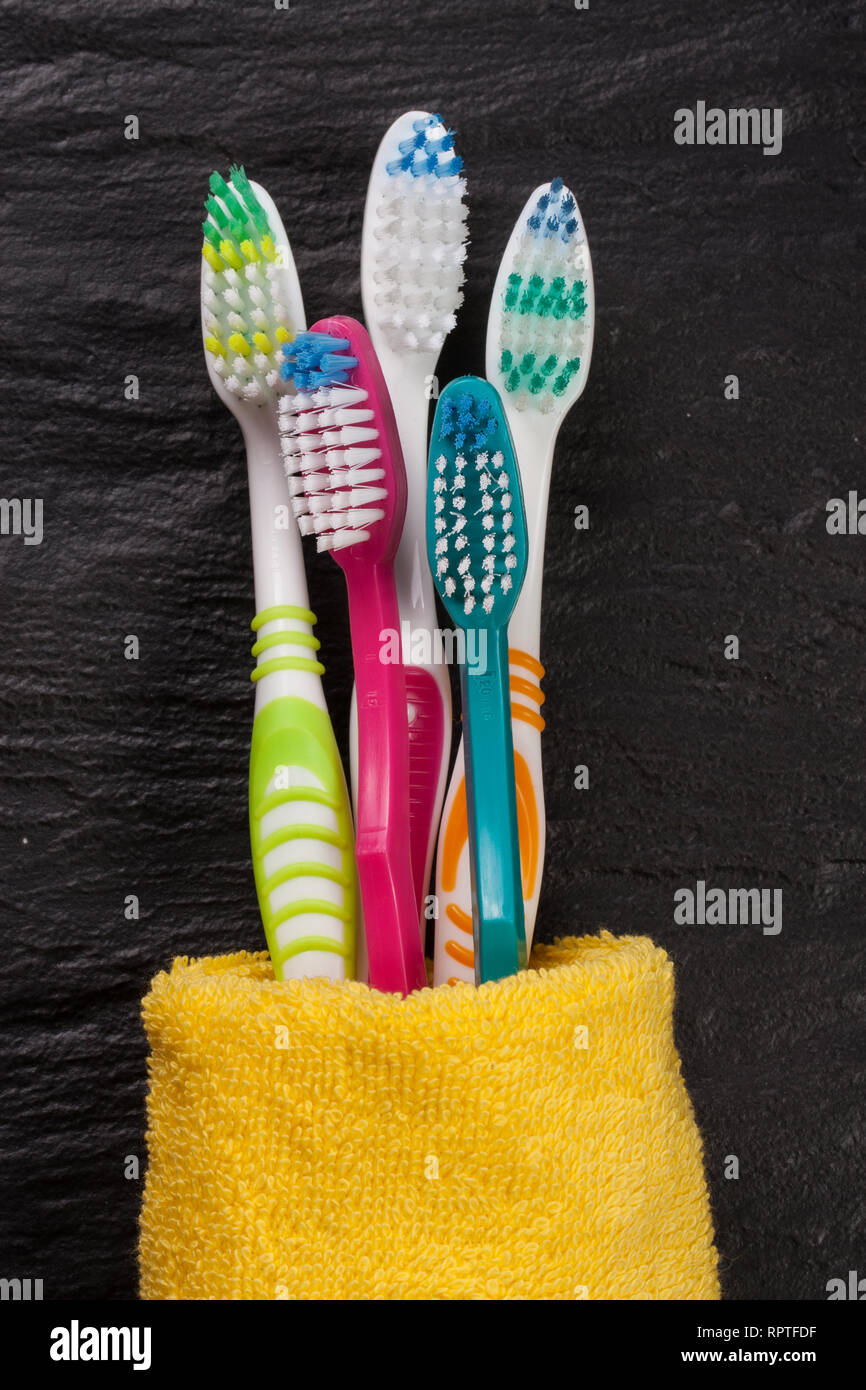 toothbrushes on the black stone background Stock Photo