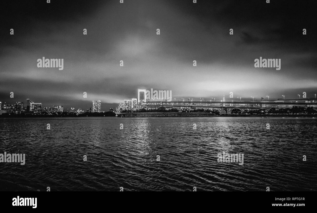 Rainbow Bridge and Skyline of Tokyo by night - beautiful view from Odaiba - TOKYO / JAPAN - JUNE 12, 2018 Stock Photo